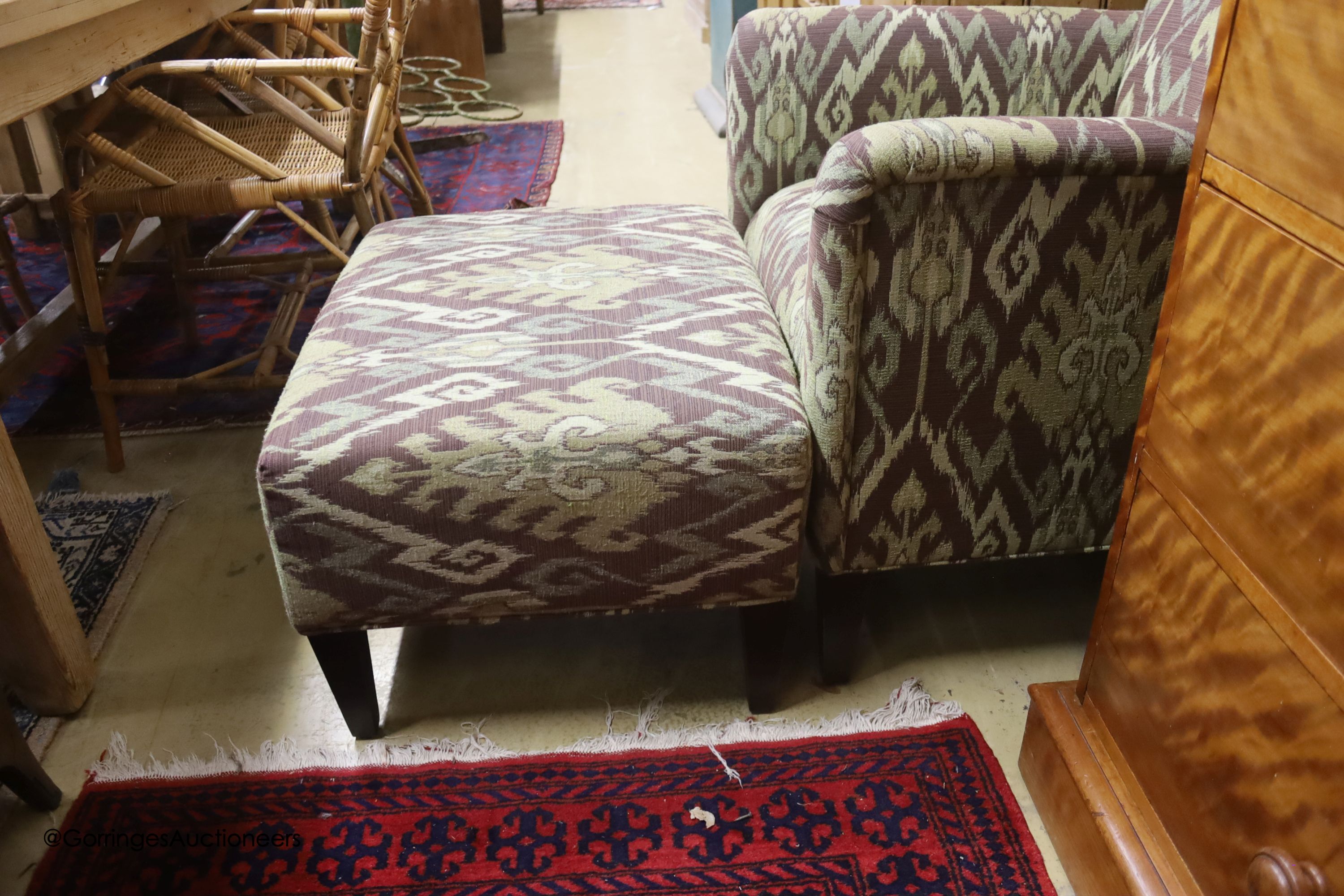 A Kelim upholstered armchair and matching footstool